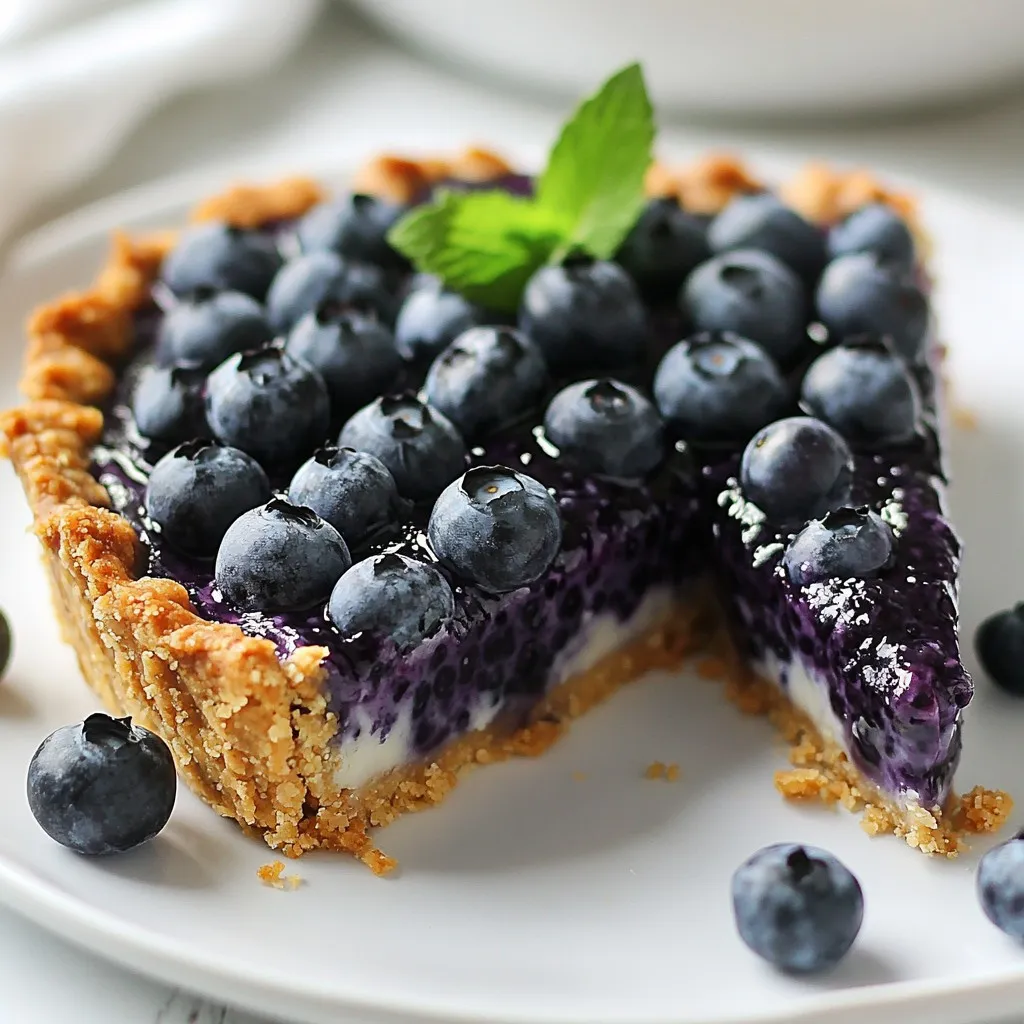 - 2 cups fresh blueberries - 1 teaspoon vanilla extract - 1/2 cup chia seeds - 1 cup crushed almonds or almond flour - A pinch of sea salt - 1/2 cup maple syrup (or honey) - 1 1/2 cups coconut milk - 1/4 cup melted coconut oil To make a no-bake blueberry chia pie, you need fresh ingredients to start. Fresh blueberries bring a sweet and tangy flavor. They are the star of this dessert. A teaspoon of vanilla extract adds warmth and depth to the pie. Next, you need dry ingredients. Chia seeds are vital. They thicken the filling and add healthy fats. The crushed almonds or almond flour forms a tasty crust. A pinch of sea salt enhances all the flavors. Now, let's talk about the liquid ingredients. Maple syrup or honey serves as a natural sweetener. Choose based on your taste. Coconut milk gives creaminess to the filling. Finally, melted coconut oil helps bind the crust together. Gather these ingredients for a simple and healthy treat. With just a few items, you can create this delicious pie. Enjoy the process of making it as much as you enjoy eating it! {{ingredient_image_1}} - In a medium bowl, mix 1 cup of crushed almonds, 1/4 cup melted coconut oil, and a pinch of sea salt. - Press this mixture firmly into the bottom of a 9-inch pie dish. Ensure it is even and compact. - In a blender, combine 2 cups of fresh blueberries, 1 1/2 cups coconut milk, 1/2 cup maple syrup, and 1 teaspoon vanilla extract. Blend until smooth. - Pour the blueberry mixture into a bowl and stir in 1/2 cup of chia seeds. Mix well to distribute the seeds evenly. - Let the mixture sit for about 10 minutes. This helps the chia seeds thicken the filling. Stir again to prevent clumping. - Pour the thickened blueberry filling into the prepared almond crust. Smooth the top with a spatula. - Cover the pie with plastic wrap and refrigerate for at least 4 hours, or until set. For the best results, chill it overnight. To avoid clumping chia seeds, make sure to mix them in well. After blending the blueberry filling, stir in the chia seeds slowly. This helps them spread out evenly. Let the mixture sit for about 10 minutes. Stir again to break up any clumps. This will give you a smooth filling. For chilling times, I recommend at least 4 hours. If you can, chill overnight for the best texture. This allows the chia seeds to absorb liquid and thicken the pie perfectly. A well-set pie makes for easier slicing and better flavor. Garnishing your pie enhances its look and taste. Top each slice with fresh blueberries for color. A sprig of mint adds a nice touch too. If you want a creamy layer, add a dollop of coconut whipped cream. For elegant toppings, consider a light drizzle of maple syrup. This adds sweetness and shine. You can also sprinkle some crushed almonds on top for crunch. These simple ideas make your pie a showstopper on any table. Pro Tips Use Frozen Blueberries: If fresh blueberries are not available, frozen ones work just as well. Just make sure to thaw and drain excess liquid before blending. Customize the Sweetness: Adjust the amount of maple syrup or honey according to your taste preference. You can also substitute with a sugar alternative if desired. Vary the Nuts: Experiment with different nuts for the crust, such as walnuts or pecans, to give the pie a unique flavor. Check the Thickness: If the filling doesn't thicken enough, let it sit longer before pouring it into the crust. Chia seeds need time to absorb liquid and set properly. {{image_2}} You can swap sweeteners in this recipe. Try using agave or stevia instead of maple syrup. Both offer a sweet taste with fewer calories. Each option gives a unique flavor to the pie. For the crust, feel free to use different nuts. Pecans or walnuts can replace almonds. Each nut brings a new taste and texture. Choose what you like best! Want to spice things up? Adding a pinch of cinnamon or nutmeg can change the flavor. These spices add warmth and depth. You can easily mix them into the blueberry filling. You can also mix in different fruits. Try raspberries or strawberries for a twist. Each fruit will create a new pie experience. Blend them with the blueberries or layer them in the filling. To store the pie in the fridge, first cover it tightly with plastic wrap. This keeps moisture in and prevents other smells from getting in. You can also use an airtight container if you prefer. The pie stays fresh for about 4 to 5 days in the fridge. After that, the chia seeds may become too soft, and the crust might lose its crunch. Can you freeze no-bake blueberry chia pie? Yes, you can! Freezing is a great way to save leftovers. To freeze, wrap the pie tightly in plastic wrap, then place it in a freezer-safe container. This helps prevent freezer burn. You can keep it frozen for up to 3 months. When ready to enjoy, move the pie to the fridge to thaw overnight. This way, it softens gently and stays fresh. If you’re in a hurry, you can let it thaw at room temperature for a couple of hours. Enjoy your pie just as good as when you made it! What is the nutritional value of chia seeds? Chia seeds are tiny but mighty! They are packed with nutrients. One ounce has: - 138 calories - 11 grams of fiber - 4 grams of protein - 9 grams of fat, mostly healthy omega-3s They also contain calcium, iron, and magnesium. These seeds help keep you full and are great for digestion. Can I make this pie vegan-friendly? Yes, you can! To make this pie vegan, use maple syrup instead of honey. The rest of the ingredients are already vegan-friendly. Just ensure you use plant-based toppings too. Enjoy this treat without worry! Why is my filling not thickening? If your filling isn’t thick, it might need more time. Chia seeds need time to absorb liquid. Let the mixture sit longer, about 15-20 minutes. If it’s still runny, add more chia seeds and mix again. How to fix a crumbly crust? A crumbly crust can be a pain. If it falls apart, add a bit more melted coconut oil. This helps bind the crust together. Press it down firmly in the pie dish. This will help it hold its shape better when you slice it. This blog post shows you how to create a delicious no-bake blueberry chia pie. You learned about key ingredients, like fresh blueberries and chia seeds, and followed step-by-step instructions on crust and filling. I shared tips for perfection and ideas for variations. Finally, we covered storage methods and common questions. Making this pie is fun and rewarding. Enjoy your tasty dessert! Keep it fresh and share with friends.